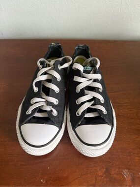 Kids Black Canvas Low-Top Sneakers with White plaid lining.